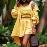 Yellow cut-out shoulder hoodie dress for women, featuring a relaxed fit and streetwear style with a focus on the shoulder and sleeve design.