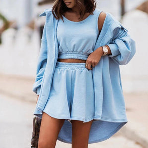 Light blue cut-out shoulder hoodie dress for women featuring long sleeves, a collar, and a relaxed fit. The dress falls above the thighs, highlighting a streetwear style with a trendy casual look.
