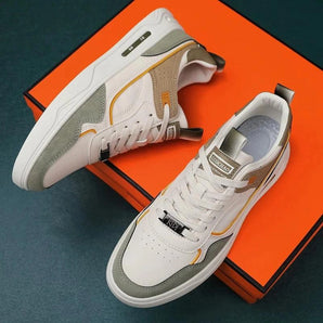 Men's white suede low-top lace-up sneakers with a sleek design suitable for casual wear and light outdoor activities.