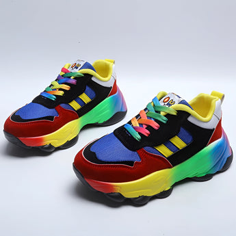 Trendy multicolor sneakers with a vibrant rainbow sole, designed for fashion and comfort, featuring an electric blue upper suitable for outdoor activities and casual walking.