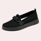 Black and grey slip-on sneakers designed for women, featuring a breathable, athletic style suitable for summer and outdoor activities.