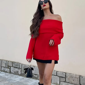 
A stylish women's red off-shoulder sweater, perfect for fall fashion, featuring a relaxed fit and cozy knitwear design.