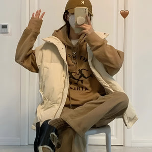 Brown oversized jacket and graphic hoodie paired with beige cargo pants, styled for streetwear fashion.