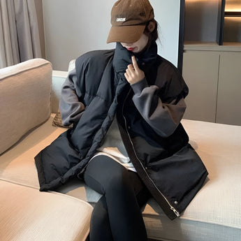 Oversized jacket with a collar and long sleeves, worn with a graphic hoodie and beige cargo pants, showcasing a streetwear fashion style.