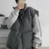 Gray oversized jacket paired with a graphic hoodie and beige cargo pants, displayed in a streetwear style, showcasing a 3XL size with focus on outerwear details such as sleeves and collars.