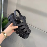 Trendy black platform sandals with open toe, chunky sole, and buckle strap in size 43.