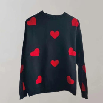 Cozy grey and pink heart pattern pullover for women with long sleeves and a round neckline, displayed in black color, size Large.