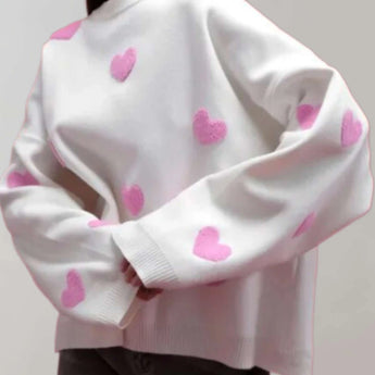 Cozy grey and pink heart pattern pullover for women, featuring long sleeves and a soft, comfortable fabric. This trendy pullover is designed with a stylish neck and collar, available in a size large, with a white and pink color scheme.