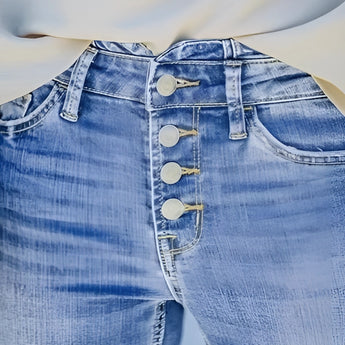 High-waisted light wash button-fly skinny jeans made from denim, showcasing a trendy fashion design with a focus on the waist and button detailing.