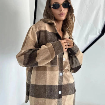 Brown oversized plaid jacket worn by a woman, styled with sunglasses and a handbag, showcasing chic autumn streetwear fashion.