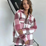 Trendy women's oversized plaid jacket featuring a chic tartan pattern in shades of pink, showcasing a wide collar, long sleeves, and casual streetwear style suitable for autumn.