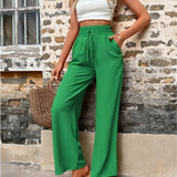 Women's fashionable grass green high-waisted palazzo pants, designed for a lightweight summer feel, shown in size XL.