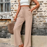 Trendy women's beige high-waisted palazzo pants in lightweight fabric, ideal for summer, shown in XL size.