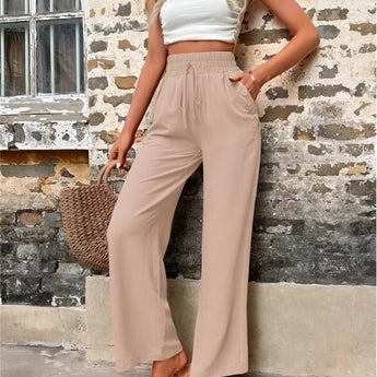 Trendy women's beige high-waisted palazzo pants in lightweight fabric, ideal for summer, shown in XL size.