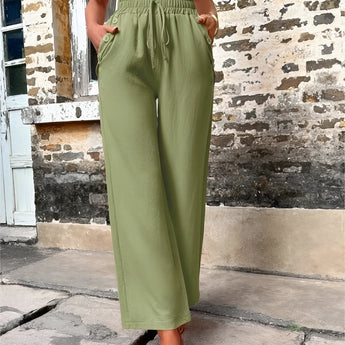 Trendy women's green high-waisted palazzo pants in XL size, made from lightweight fabric suitable for summer.