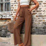 Trendy Women's Pink High-Waisted Palazzo Pants - Lightweight Summer, modeled indoors.