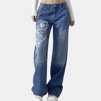 Trendy women's blue printed wide-leg jeans in urban and hip-hop fashion style, showcasing a relaxed fit with emphasis on the waist and thigh areas, made from denim material.