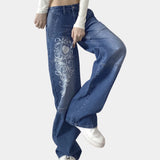 Wide-leg jeans with a trendy print, worn by a woman from an urban and hip-hop fashion style, showcasing the denim design and fit.