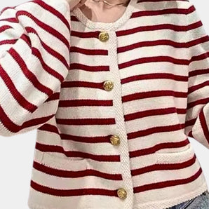 Trendy women's red and white striped cardigan featuring gold buttons, displayed on a mannequin or flat surface, highlighting its fashionable outerwear design with distinct stripe pattern and elegant button detail.