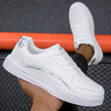Trendy women's white low-top sneakers featuring gold accents, designed for casual wear and sports activities.