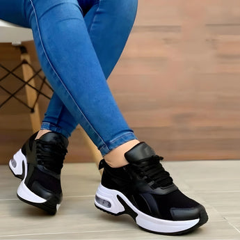 White sneakers for women with a bold sole, showcasing a trendy design suitable for fashion-forward outfits.