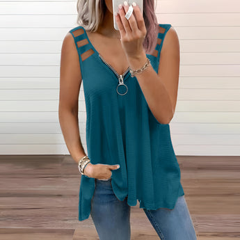 Woman wearing a trendy green V-neck tank top with a front zipper, suitable for casual summer wear, standing with arms and hands visible.