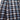Stylish navy, white, and brown checkered wool blend plaid coat with a classic tartan pattern, featuring a collar and sleeves, showcasing a trendy and textured design.