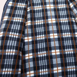 Stylish navy, white, and brown checkered wool blend plaid coat with a classic tartan pattern, featuring a collar and sleeves, showcasing a trendy and textured design.