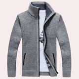Navy, white, and brown checkered wool blend plaid coat with a light gray background, featuring long sleeves, a classic collar, and tailored design, resembling an overcoat or blazer style.