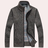 Navy, white, and brown checkered wool blend plaid coat with long sleeves and a structured collar, featuring a classic tartan pattern.