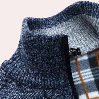 A stylish wool blend plaid coat featuring a navy, white, and brown checkered pattern, with long sleeves and a textured textile design.