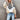 Oversized knit sweater with a gray, white, and black chevron pattern, featuring long sleeves, a high neckline, and a loose fit, styled for winter fashion.