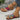 Tribal Pattern Women's Sandals in Red, size 42, Boho Chic Summer Footwear with colorful tribal designs on straps, modeled on a person's feet.