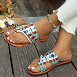 Tribal pattern women's sandals with boho chic design, featuring an intricate strap pattern, being worn on a woman's feet.