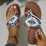 Tribal pattern women's sandals paired with denim shorts, showcasing a boho chic summer style.
