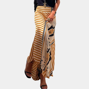 Yellow striped bohemian maxi skirt with tribal print, wrap style, displayed on a mannequin.