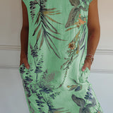 
A green tropical botanical print sleeveless summer shift dress designed as beachwear, displayed in size 3XL. The dress features a one-piece garment design with a round neck and is patterned with vibrant botanical prints.