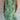 
A green tropical botanical print sleeveless summer shift dress designed as beachwear, displayed in size 3XL. The dress features a one-piece garment design with a round neck and is patterned with vibrant botanical prints.