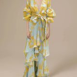 Yellow and blue tropical floral maxi dress with sleeves, featuring a wrap design and a v-neckline, in size 2XL.