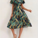Tropical Leaf V-Neck Mini Dress featuring a bohemian style, short sleeves, and a fitted waist, perfect for summer resort wear.