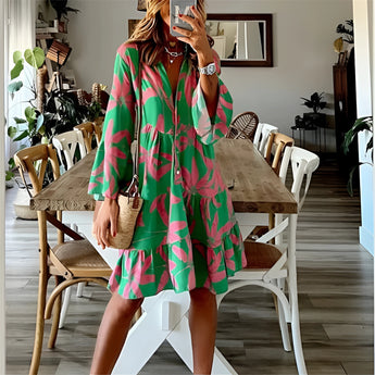 Tropical print button-up mini dress in green and pink, featuring short sleeves and a fitted waist.