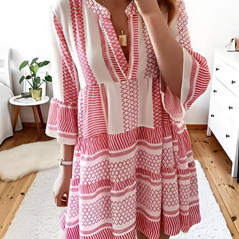 Tropical print button-up mini dress featuring a vibrant green and pink summer style with a collared neckline and short sleeves, modeled in a red color variant, size 3XL, displayed against a neutral background.