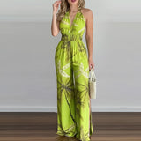 Tropical Print Halter Maxi Dress in yellow green, size 2XL, featuring a vibrant design, sleeveless halter neckline, fitted waist, and flowing skirt, modeled by a person, ideal for beach weddings and resort wear.