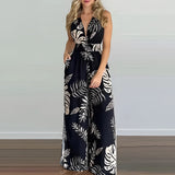 Tropical print halter maxi dress in Nero color, designed as a one-piece garment. Suitable for beach weddings and resort wear, the dress features a flowing skirt that extends to the ankles and a fitted waist for an elegant silhouette. Tailored for a 2XL size, it showcases a sleeveless design with a stylish halter neckline.