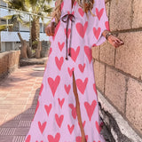 Tropical print maxi dress in pink, featuring a flowy design perfect for resort wear. The dress includes a high slit, off-the-shoulder style, and is available in size 2XL.