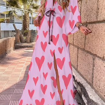 Tropical print maxi dress in pink, featuring a flowy design perfect for resort wear. The dress includes a high slit, off-the-shoulder style, and is available in size 2XL.
