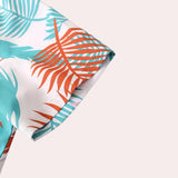 Tropical print men's shirt and shorts set featuring a vibrant leaf pattern, suitable for beachwear. The set showcases electric blue tones with artistic and creative graphics, emphasizing a fashionable and stylish design.