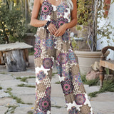 Tropical Print Palm Leaf Sleeveless Jumpsuit in viola, features a vibrant and stylish design with palm leaf patterns, perfect for women's summer beachwear. The jumpsuit is sleeveless, showcasing a fitted waist, and is available in size 2XL. The model accessorizes with eyewear, complementing the fashion-forward look.