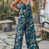 Tropical print palm leaf sleeveless jumpsuit in dark green for women, suitable for summer beachwear, shown in size 2XL. The jumpsuit features a sleeveless design with a comfortable fit around the waist and a stylish neckline, perfect for warm weather.