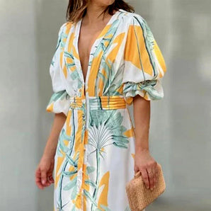 Tropical print V-neck midi dress featuring puff sleeves and a lightweight design, perfect for summer fashion.